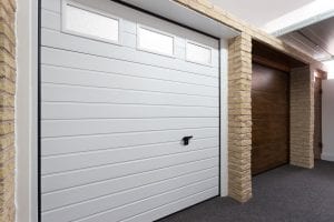 white panelled garage door with glass and brown panelled garage door