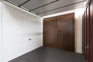 white panelled garage door and brown panelled garage doors