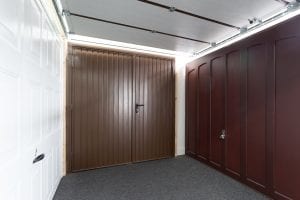 white panelled garage door and brown panelled garage doors