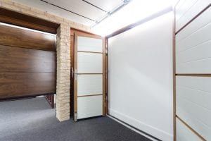 white double garage doors and brown panelled garage door