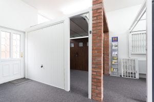 showroom with brown and white garage doors
