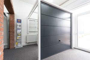 showroom with grey garage door