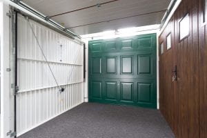 showroom with green, brown and white garage doors