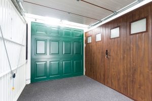 showroom with green, brown and white garage doors
