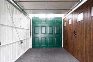showroom with green, brown and white garage doors