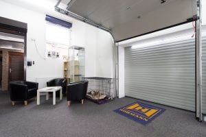 showroom with waiting area and white roller door