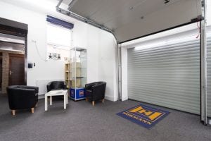 showroom with waiting area and white roller door