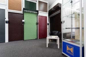 showroom with waiting area and lots of different coloured roller shutters