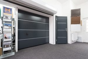 showroom with grey garage door, grey security door, samples and brochures