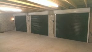 three electric roller garage doors