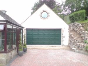 green sectional double garage door