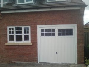 white up and over garage door with glass panels